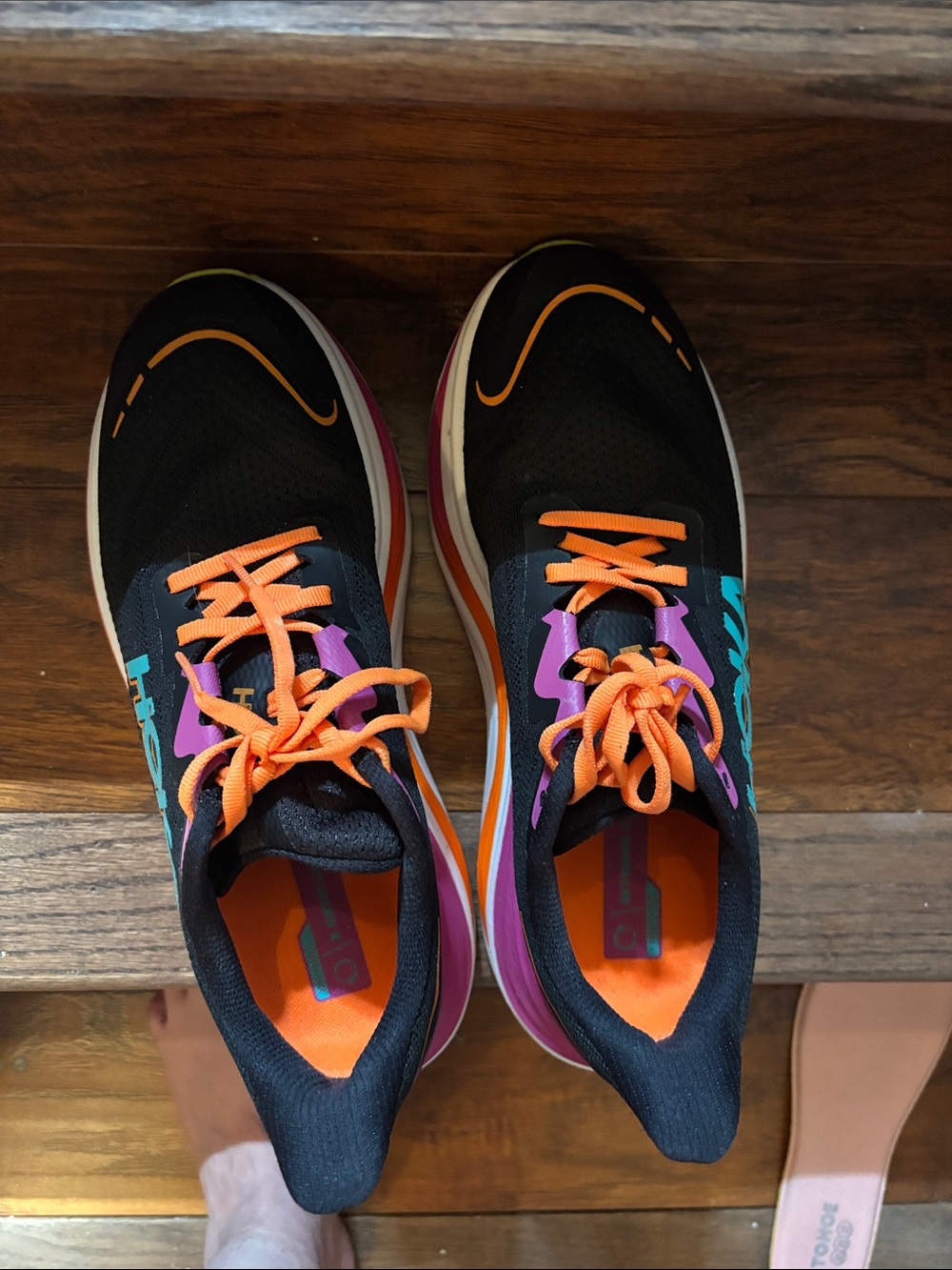 Women Hoka Black Running Shoes with Orange Laces and Purple Accents